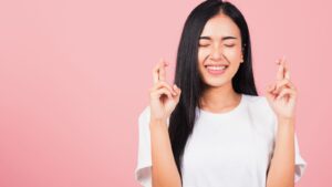 pic of a lady with her fingers crossed